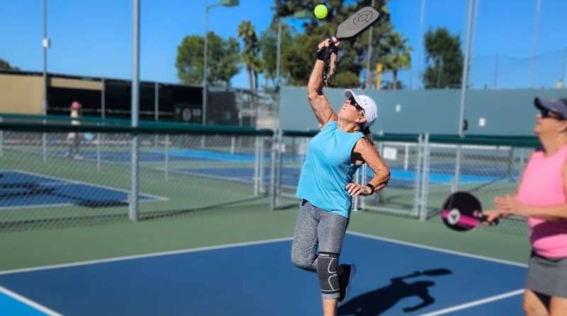 Avid pickleball player Carole Harland says doing dynamic warmups and stretching pre-game is a key to staying injury-free on the court. Credit: Carole Harland
