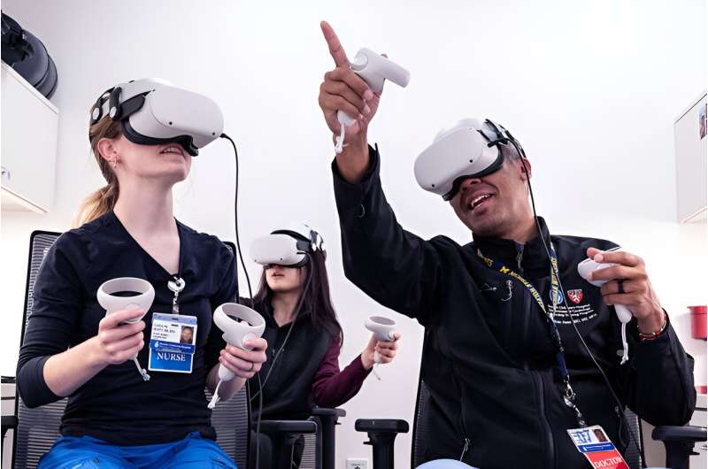 Dr. Jonathan Awori explores the virtual heart with nurse Carolyn Burtt (left), while extended reality designer Angelina Gu joins the fun. Credit: Michael Goderre/Boston Children's Hospital